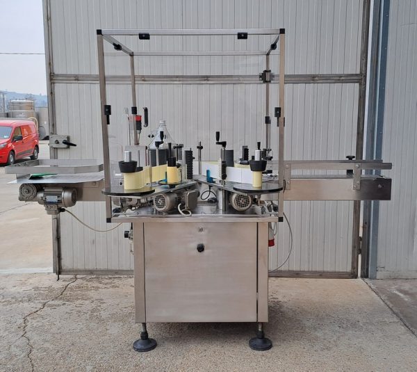 ADHESIVE LABELLING MACHINE ENOS MOD. “BASE” FOR ROUND AND SQUARE BOTTLE UP TO  5 LT WITH TWO STATION, SECOND-HAND MACHINE - Image 6